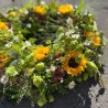 Tröstender Blumenkranz